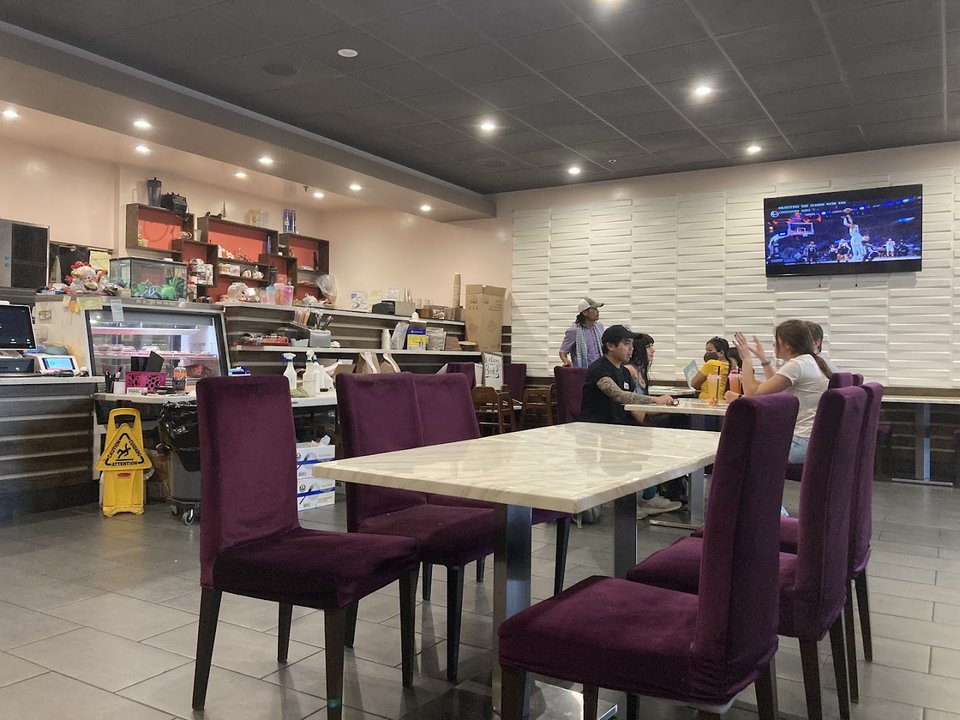 Modern dining tables in a small, low-key restaurant.