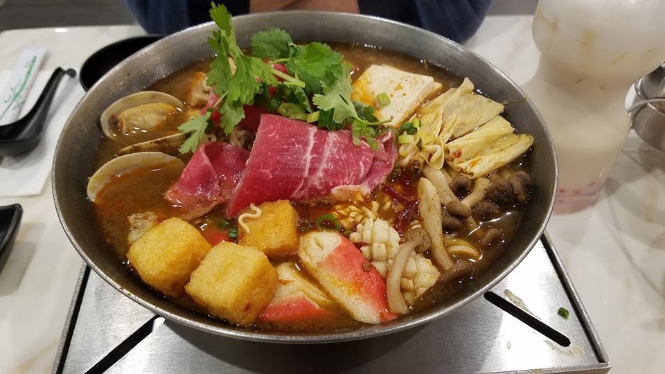 Ramen, soups, and smoothies listed on a menu.