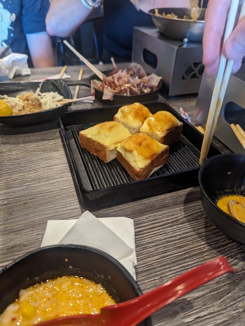 Ramen, soups, and smoothies listed on a menu.